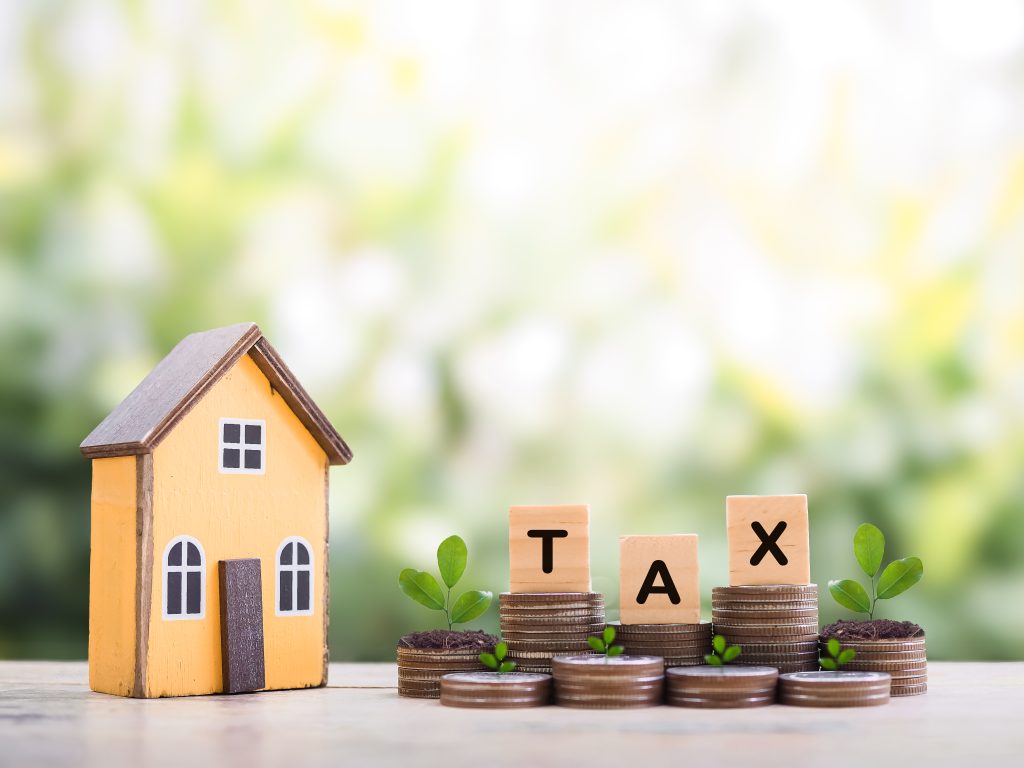 vecteezy_miniature-house-wooden-blocks-with-the-word-tax-and-plans_50104694 - Kabat, Schertzer, De La Torre, Taraboulos & Co.